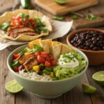 Side-by-side burrito and taco bowls featuring fresh ingredients like grilled chicken, black beans, tortilla chips, and vibrant toppings.