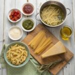 An assortment of pasta types with matching sauces, showcasing how to choose the best pasta for every dish.